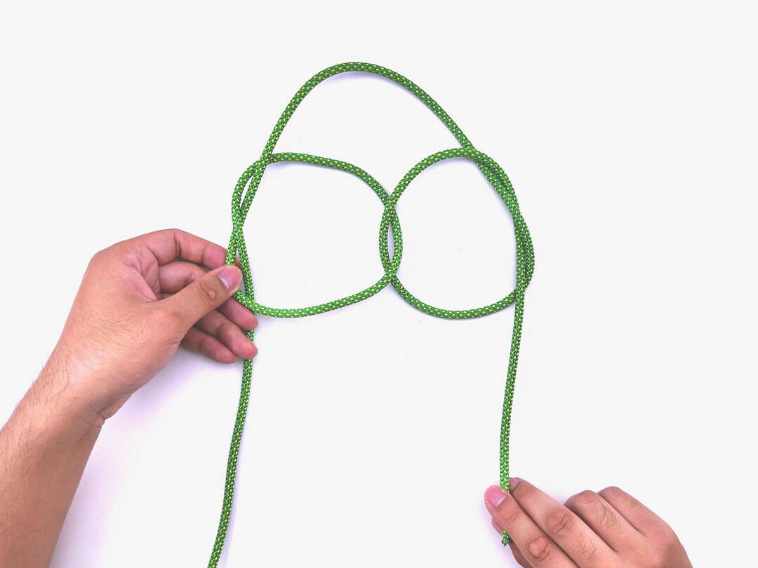 Step 8 of tying the Sailor's Cross knot - detailed visual instruction