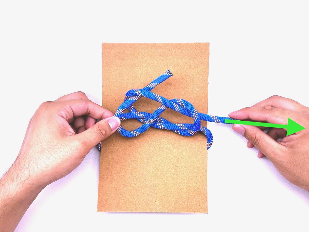 Step 4 of tying the Slipped Square Knot knot - detailed visual instruction