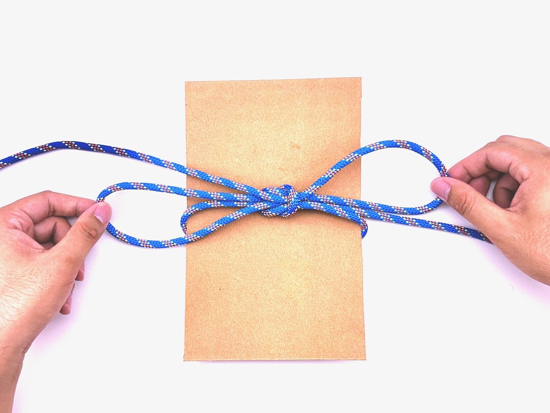 Step 6 of tying the Slipped Square Knot Doubled knot - detailed visual instruction