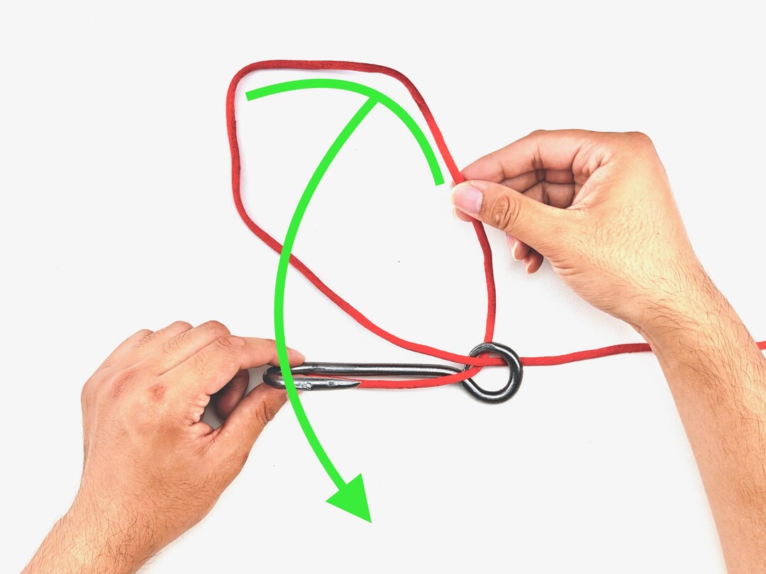 Step 2 of tying the Snelling a Hook knot - detailed visual instruction