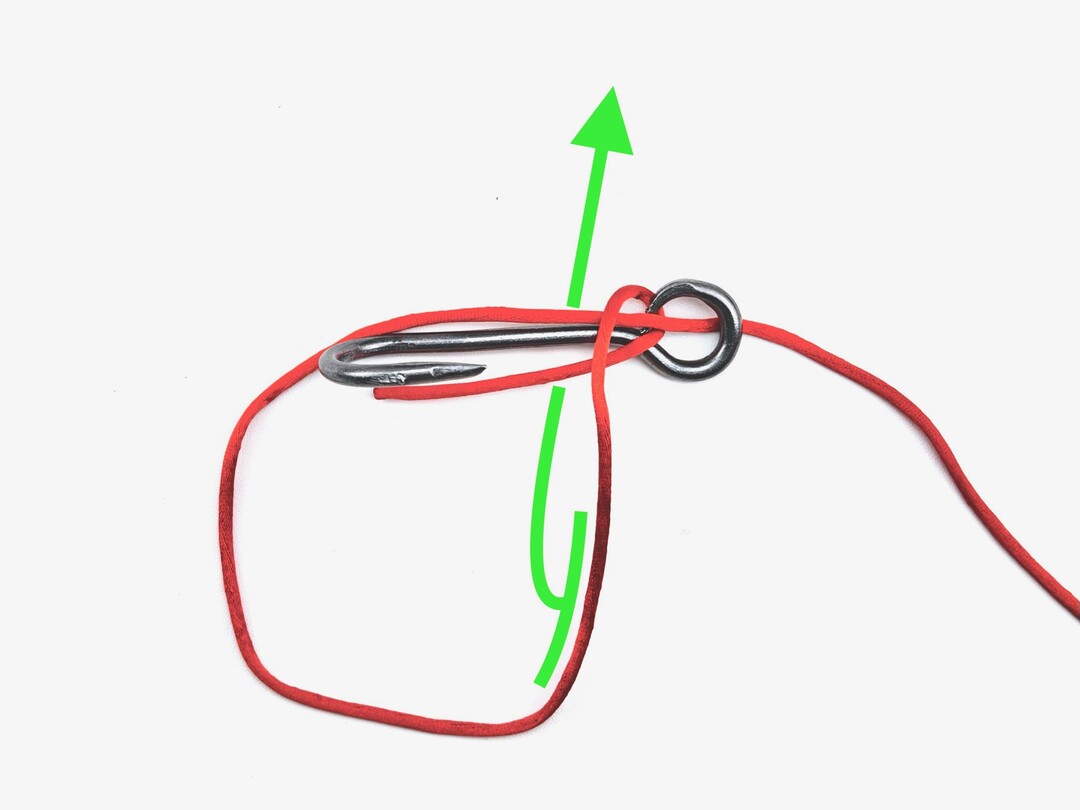 Step 3 of tying the Snelling a Hook knot - detailed visual instruction