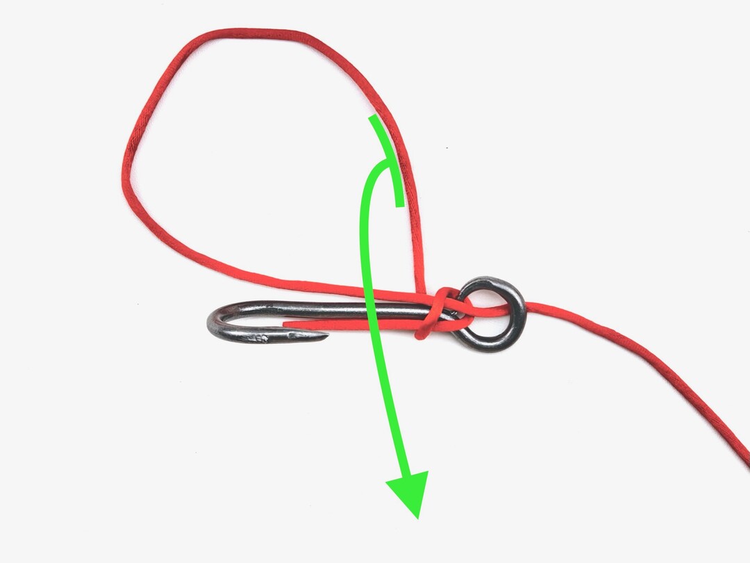 Step 4 of tying the Snelling a Hook knot - detailed visual instruction