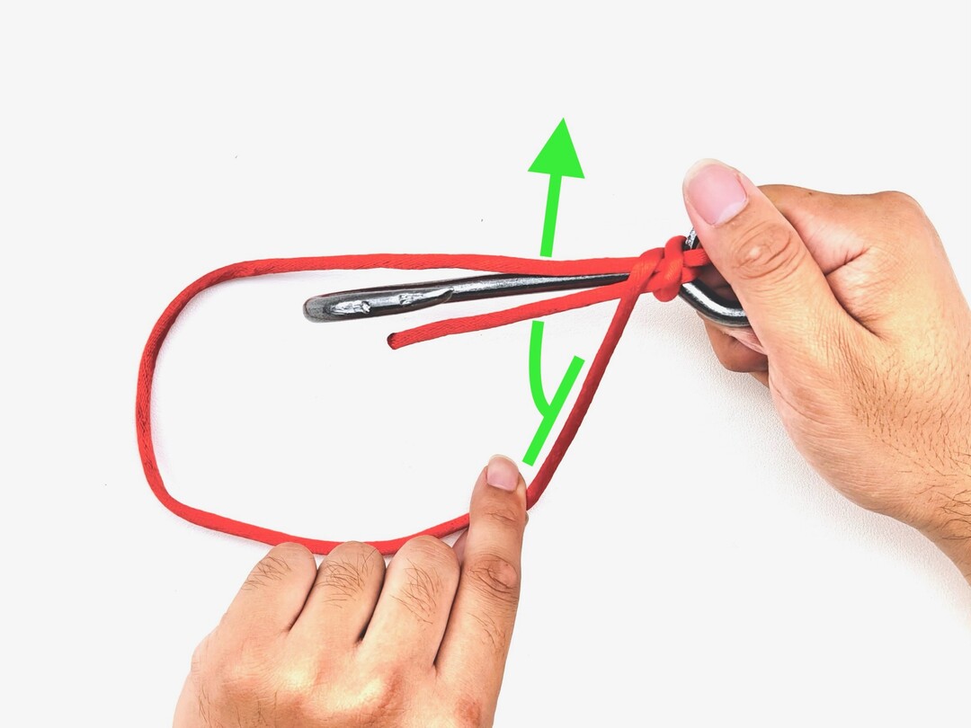 Step 5 of tying the Snelling a Hook knot - detailed visual instruction