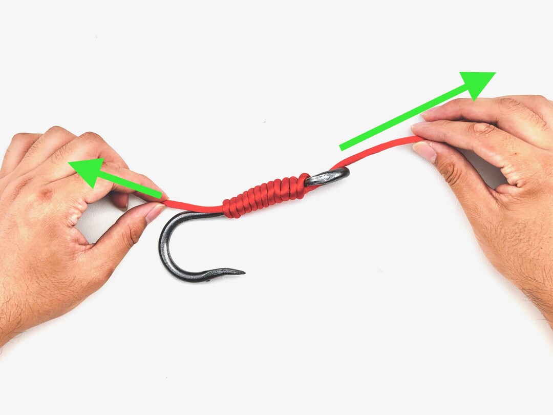 Step 8 of tying the Snelling a Hook knot - detailed visual instruction