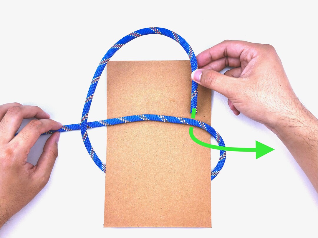 Step 2 of tying the Square Knot knot - detailed visual instruction