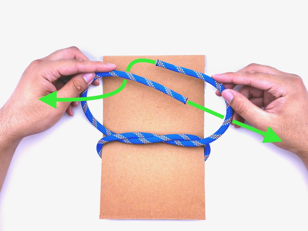 Step 3 of tying the Square Knot knot - detailed visual instruction