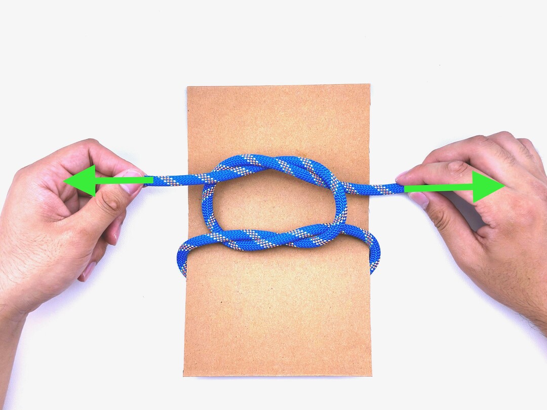 Step 4 of tying the Square Knot knot - detailed visual instruction