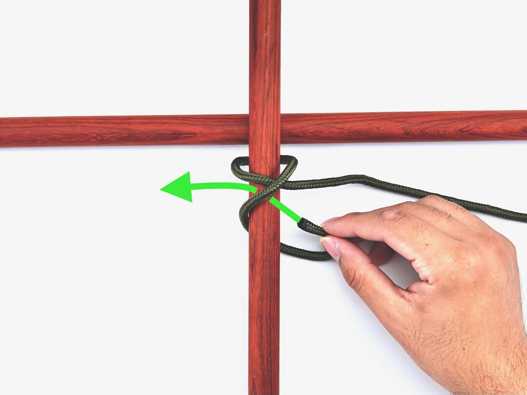 Step 2 of tying the Square Lashing knot - detailed visual instruction