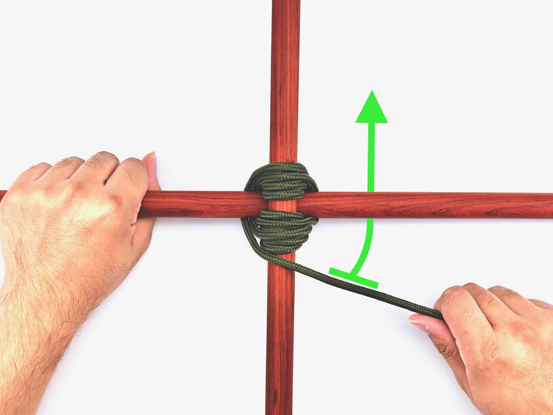 Step 5 of tying the Square Lashing knot - detailed visual instruction