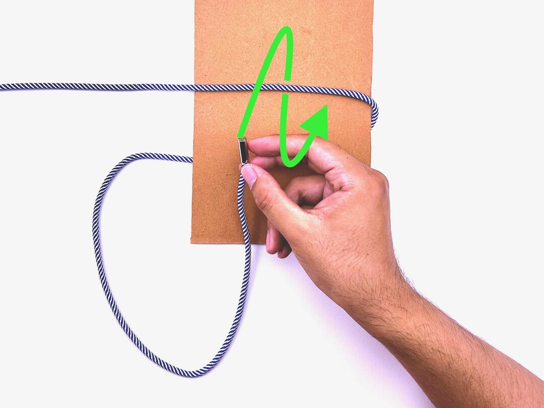 Step 2 of tying the Surgeon's Knot knot - detailed visual instruction