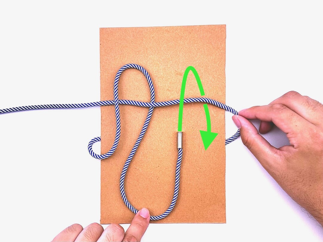 Step 3 of tying the Surgeon's Knot knot - detailed visual instruction