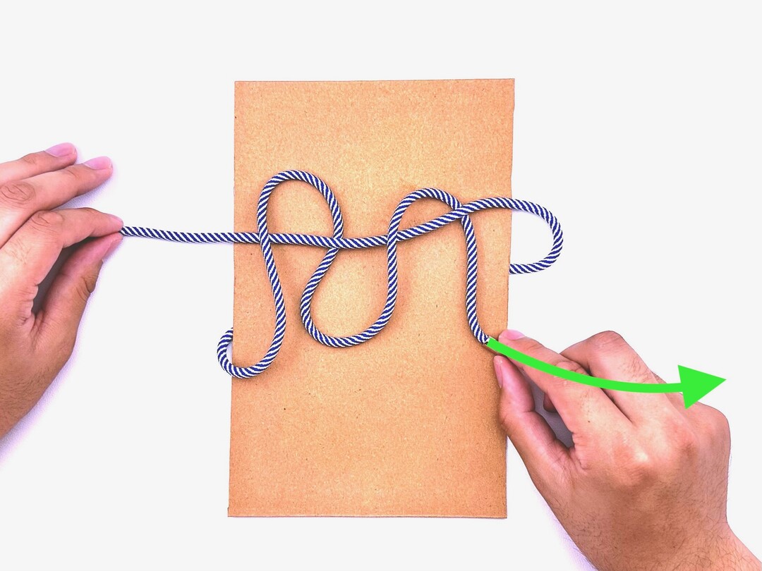 Step 4 of tying the Surgeon's Knot knot - detailed visual instruction