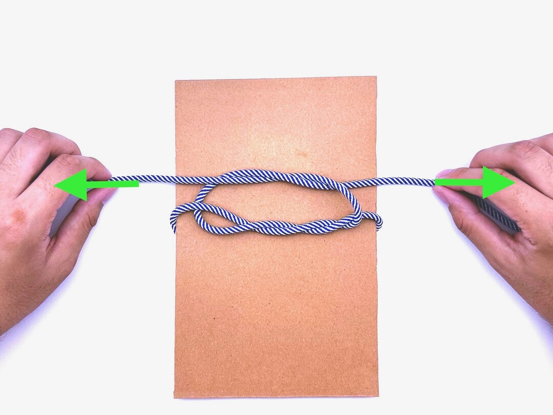 Step 6 of tying the Surgeon's Knot knot - detailed visual instruction