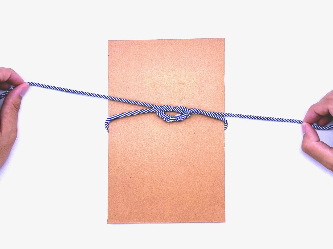 Step 7 of tying the Surgeon's Knot knot - detailed visual instruction