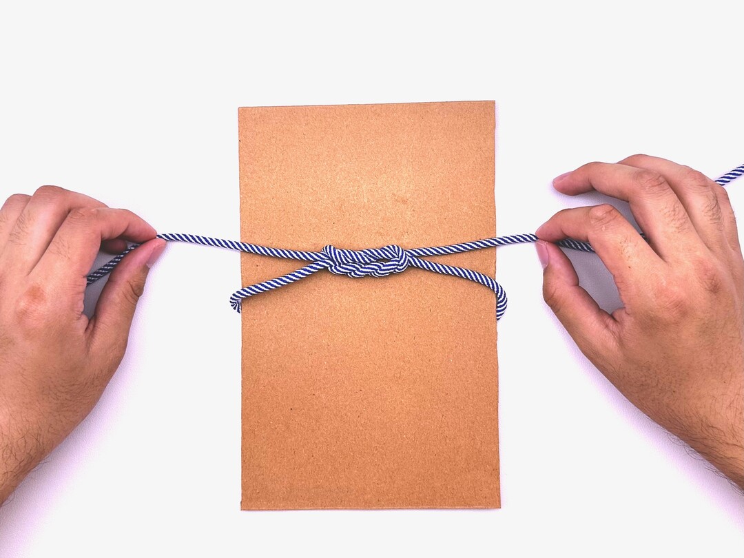 Step 7 of tying the Surgeon’s Knot with Second Tuck knot - detailed visual instruction