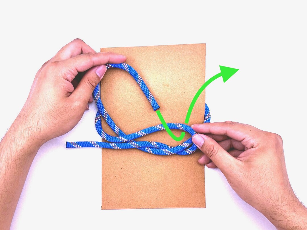 Step 4 of tying the Thief Knot knot - detailed visual instruction