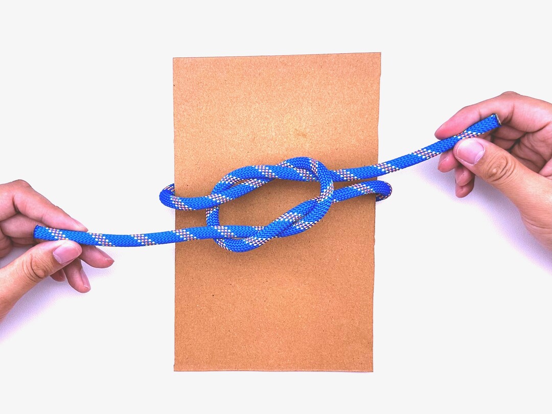 Step 5 of tying the Thief Knot knot - detailed visual instruction