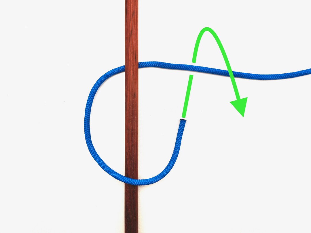 Step 1 of tying the Timber Hitch knot - detailed visual instruction