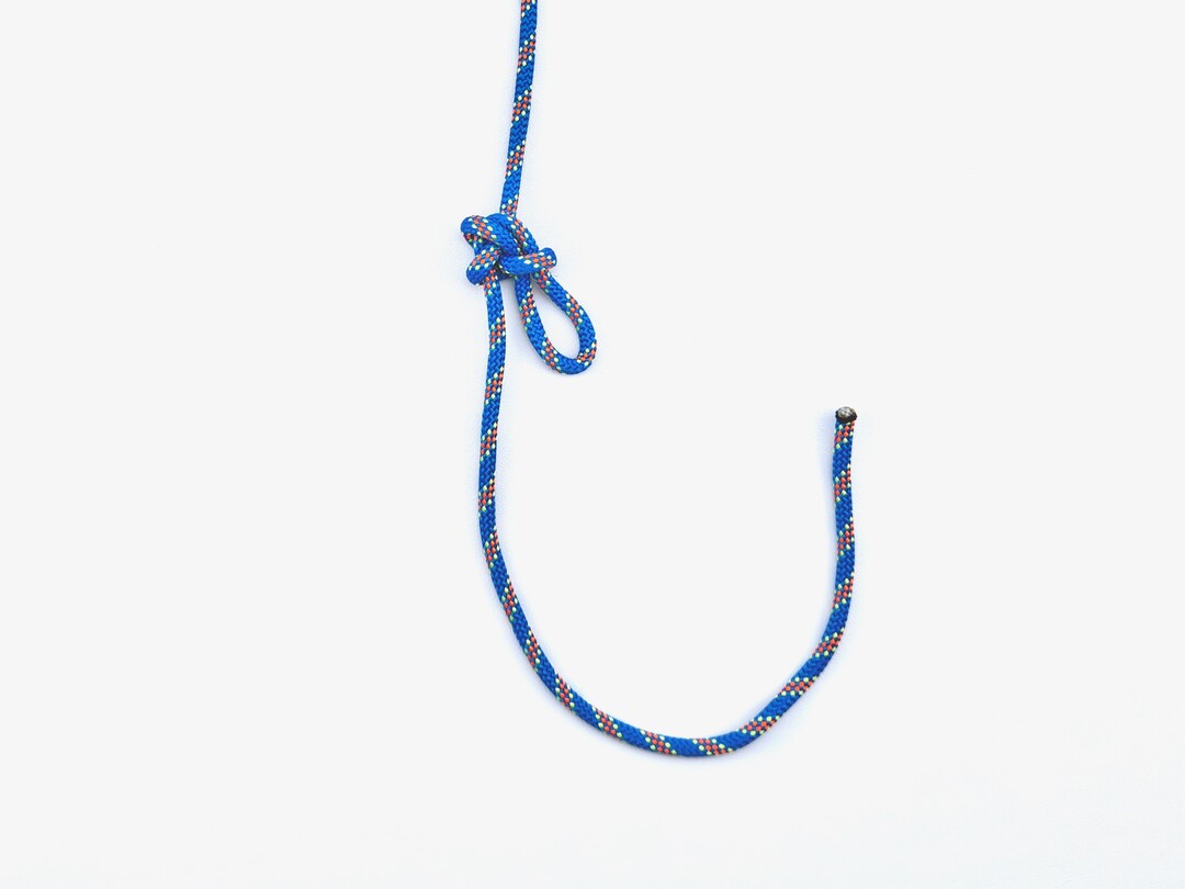 Step 3 of tying the Trucker's Hitch knot - detailed visual instruction