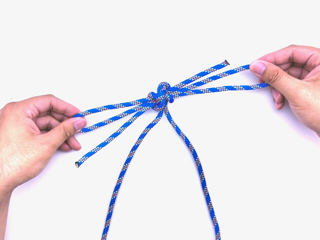 Step 8 of tying the Turquoise Turtle Knot knot - detailed visual instruction