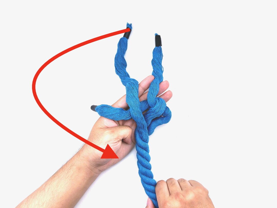 Step 5 of tying the Wall Knot knot - detailed visual instruction