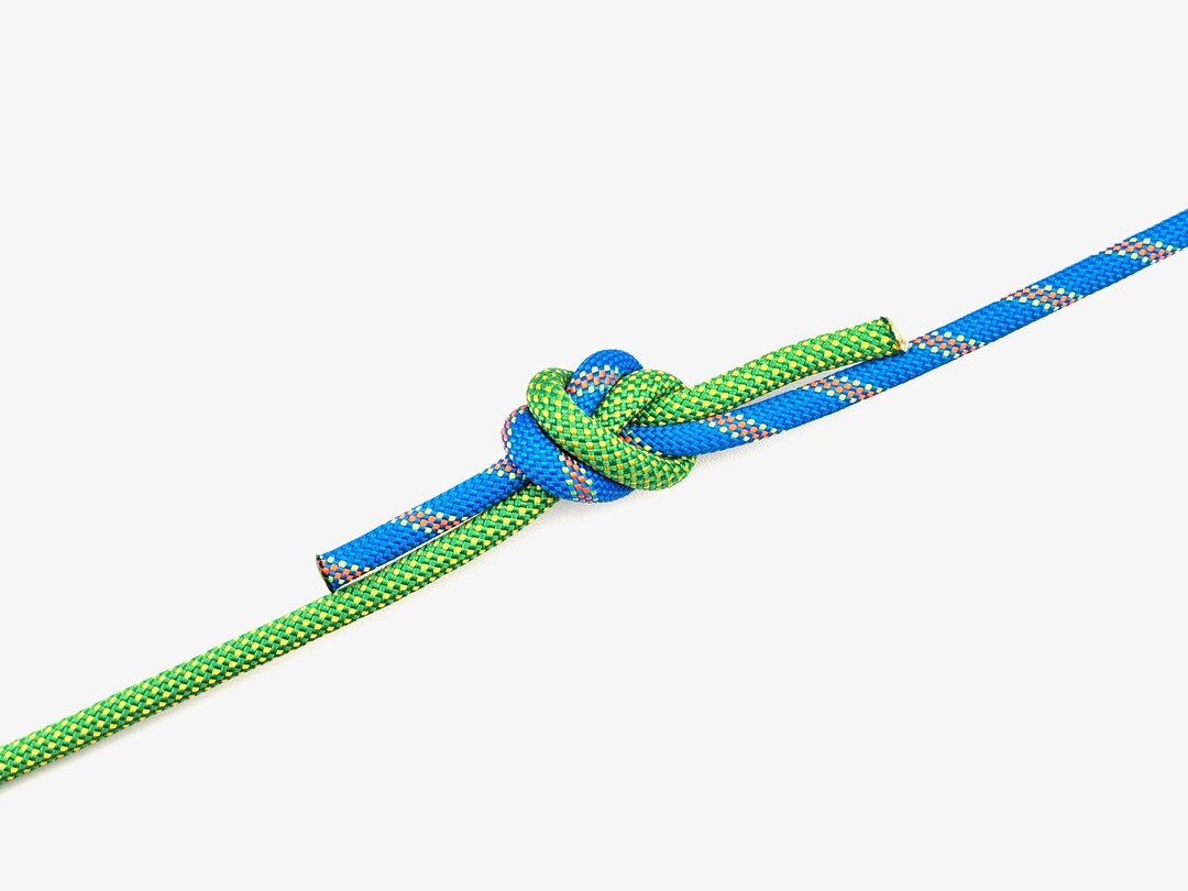 Step 6 of tying the Water Knot knot - detailed visual instruction